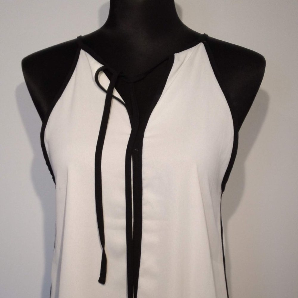 White Polyester Flowing shoulder strap camisole with Black trim